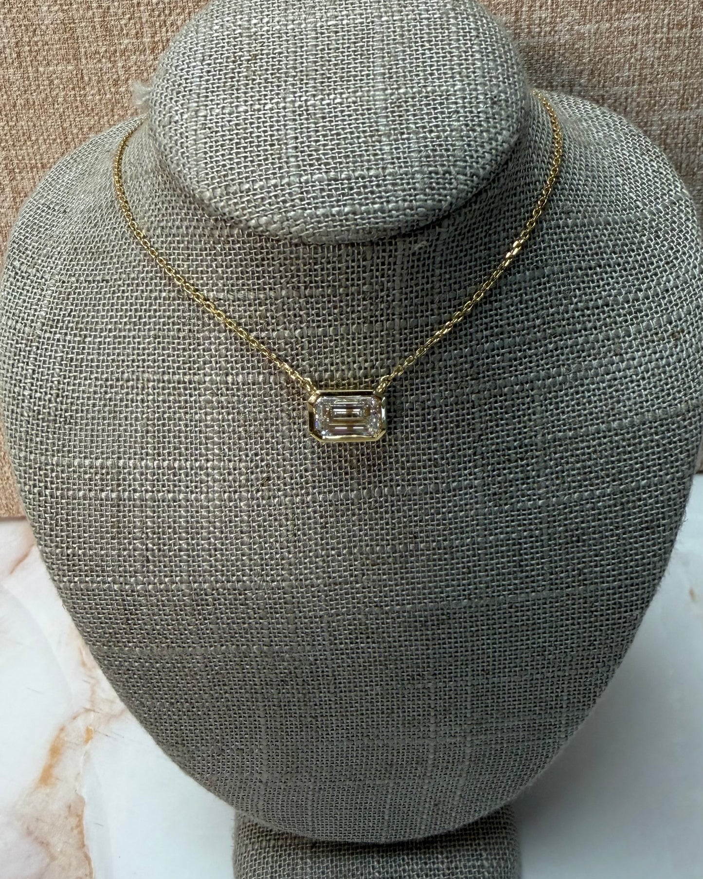 2 ct east west emerald bezel necklace