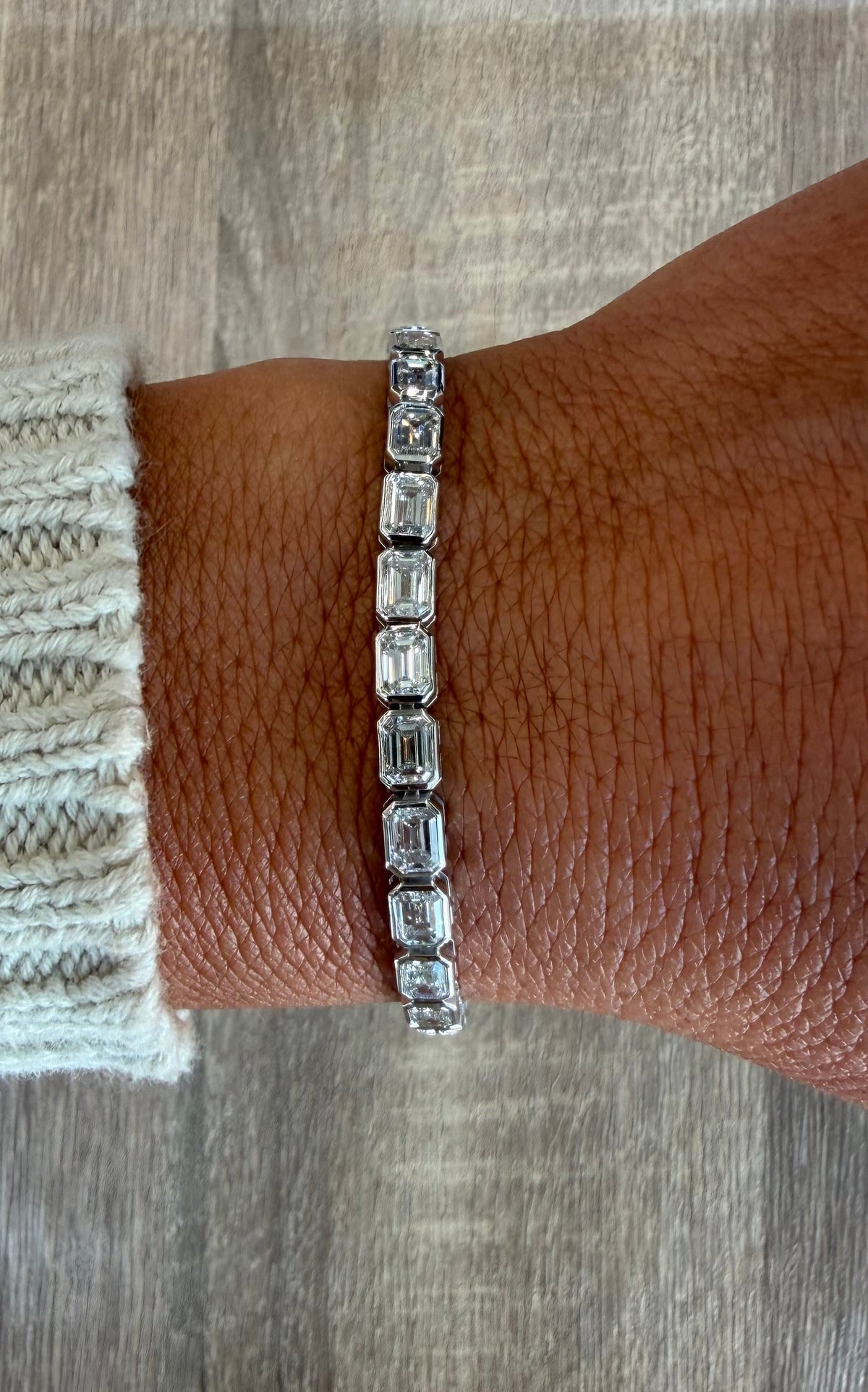 10.29 cttw east west emerald white gold bezel tennis bracelet