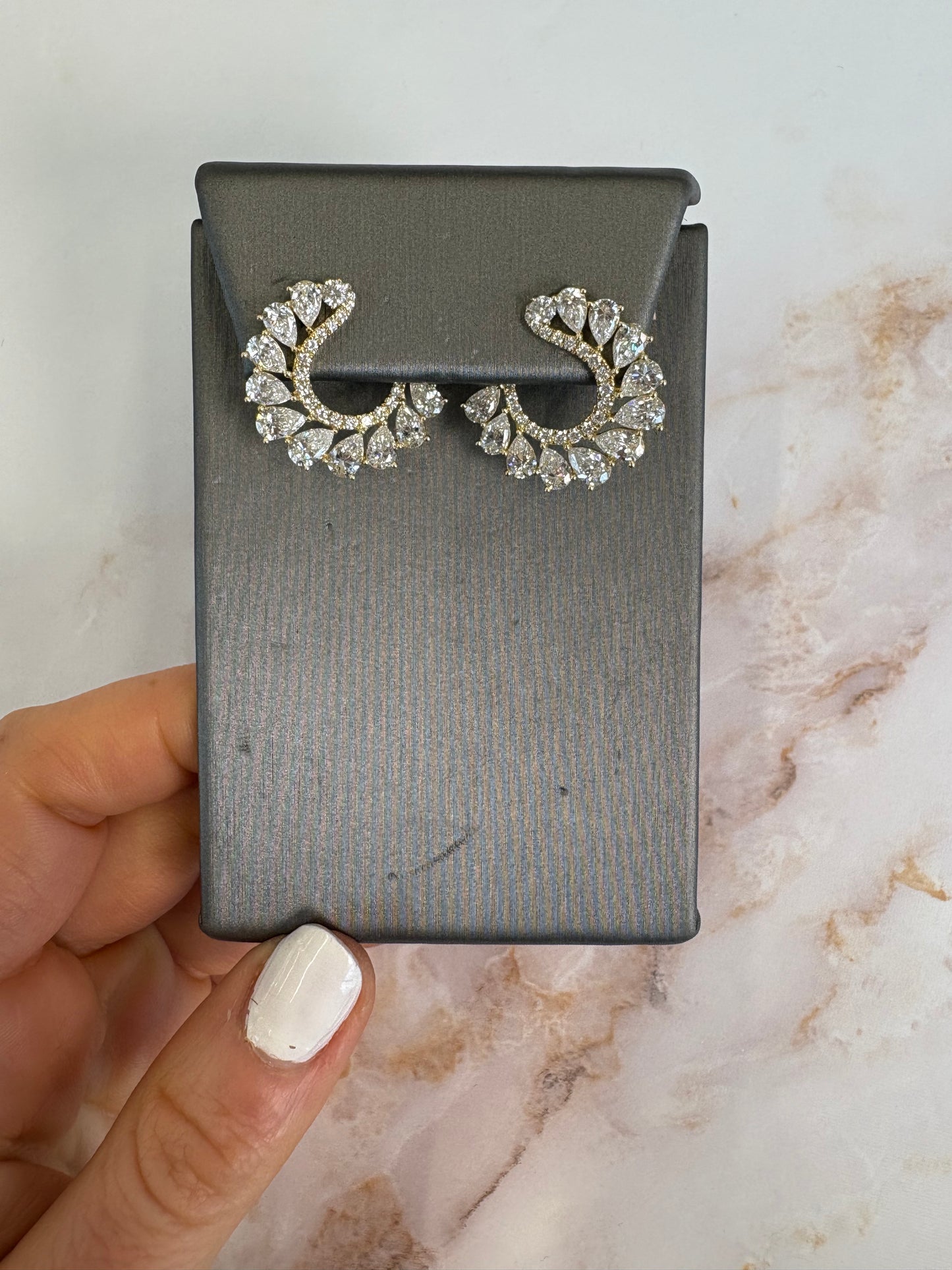 Yellow gold pear front facing hoops
