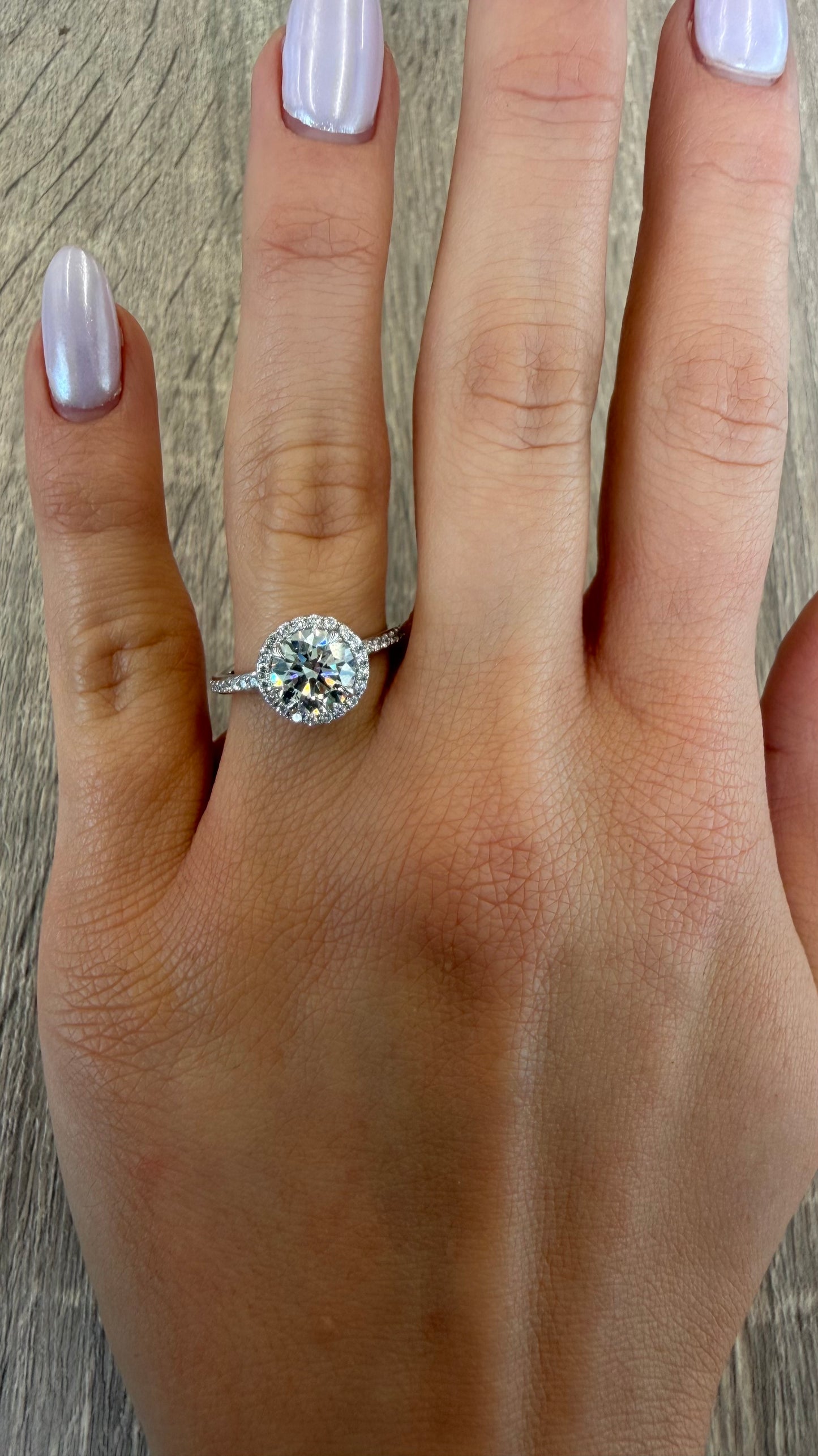 1.79 cttw round diamond with halo on pave band