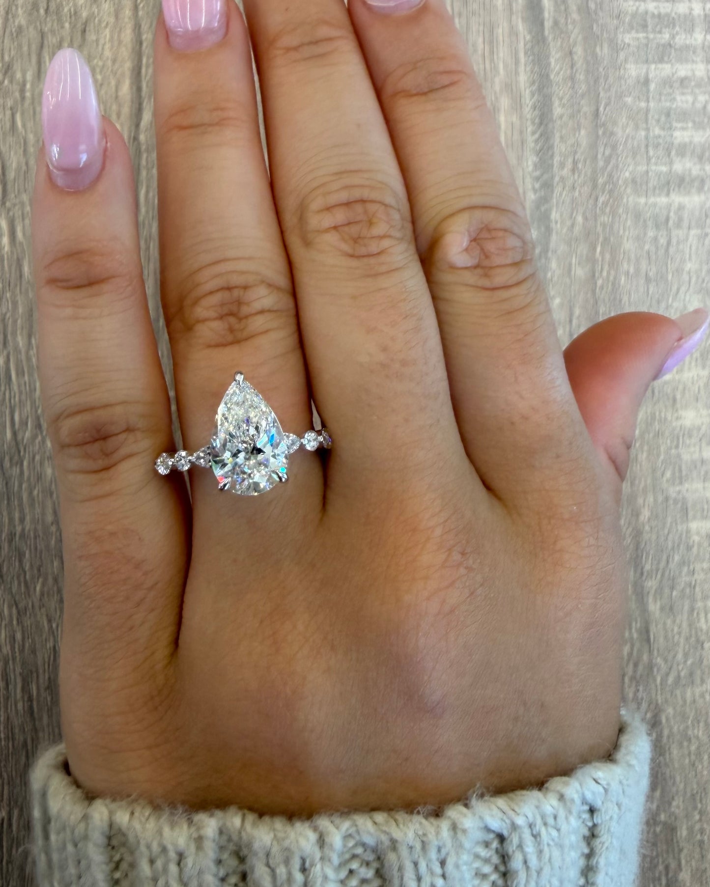 3.5 cttw pear with rounds on band