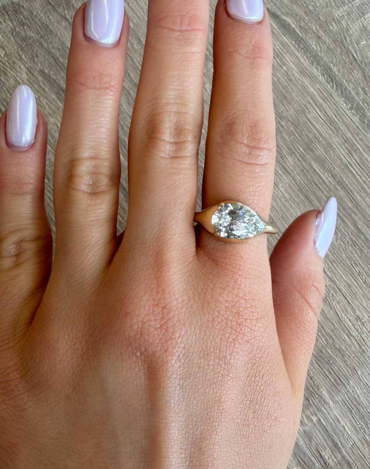 3 ct east west bezel pear ring