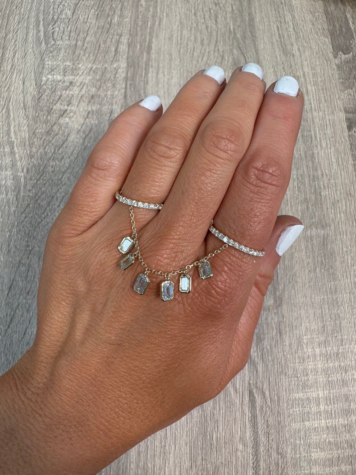 Pave 2 Finger Ring with Hanging Bezel Emeralds