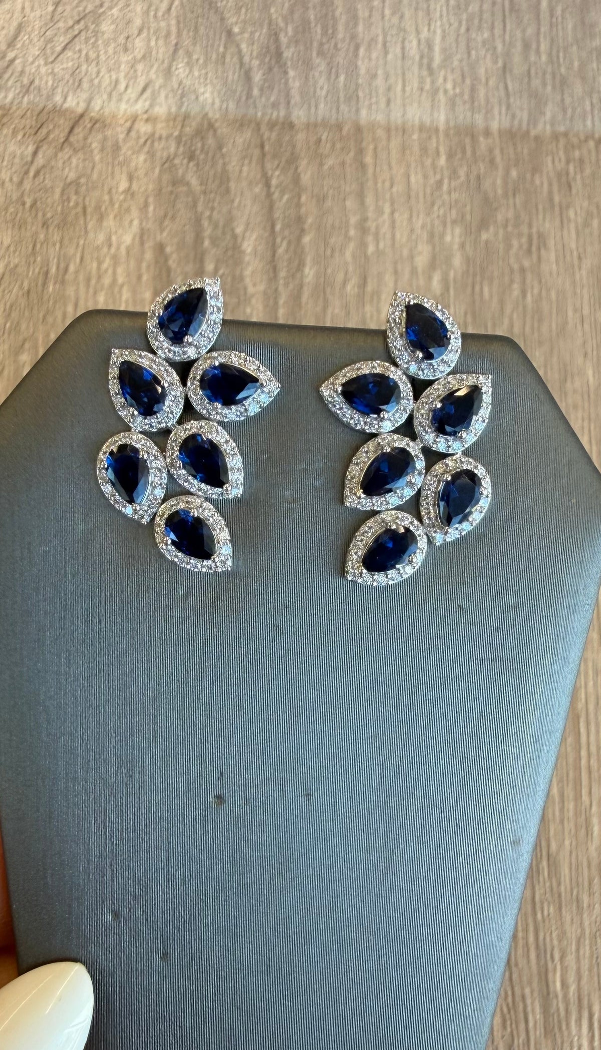 Blue sapphire halo pear earrings