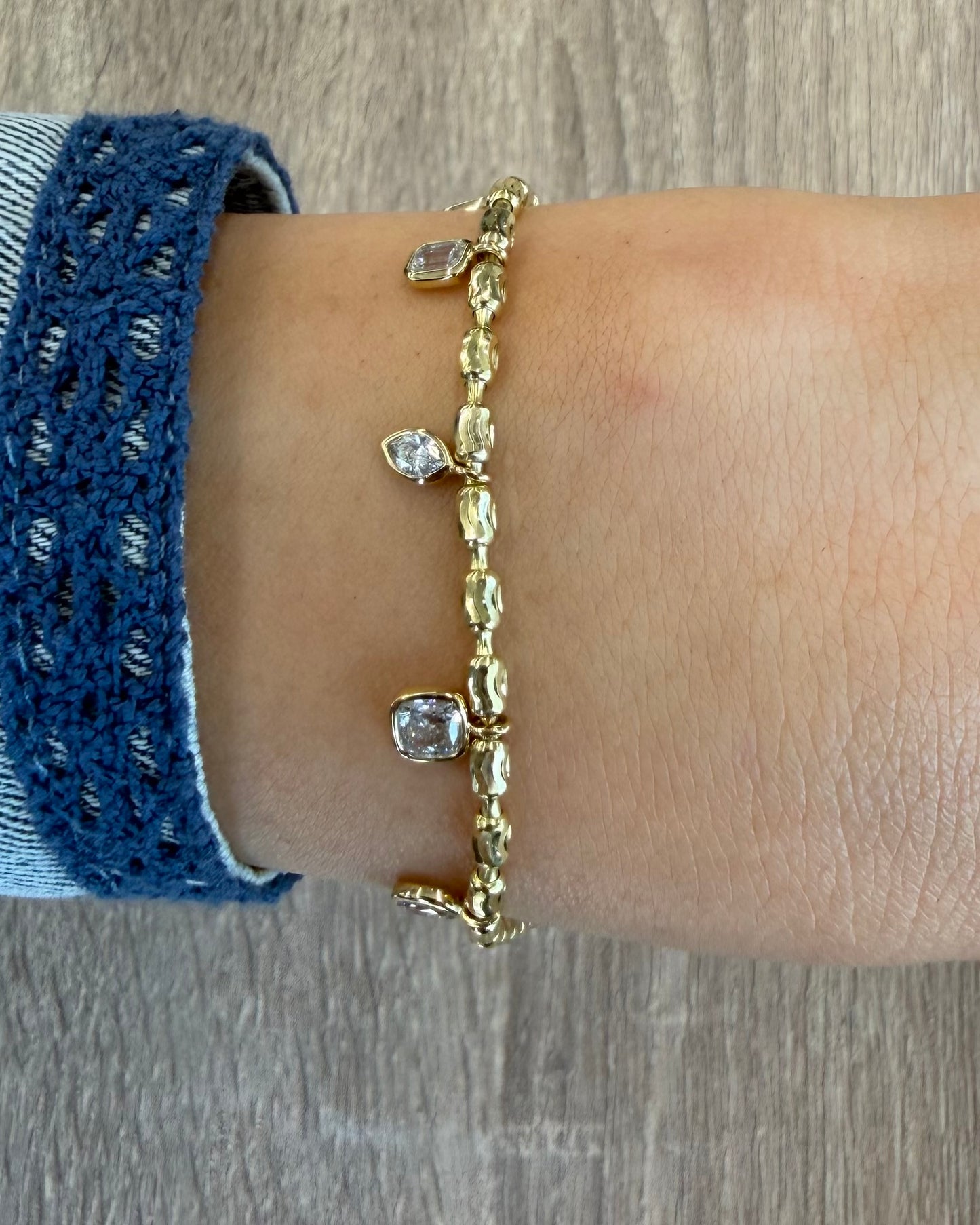 1.2 cttw yellow gold bracelet with bezel charms