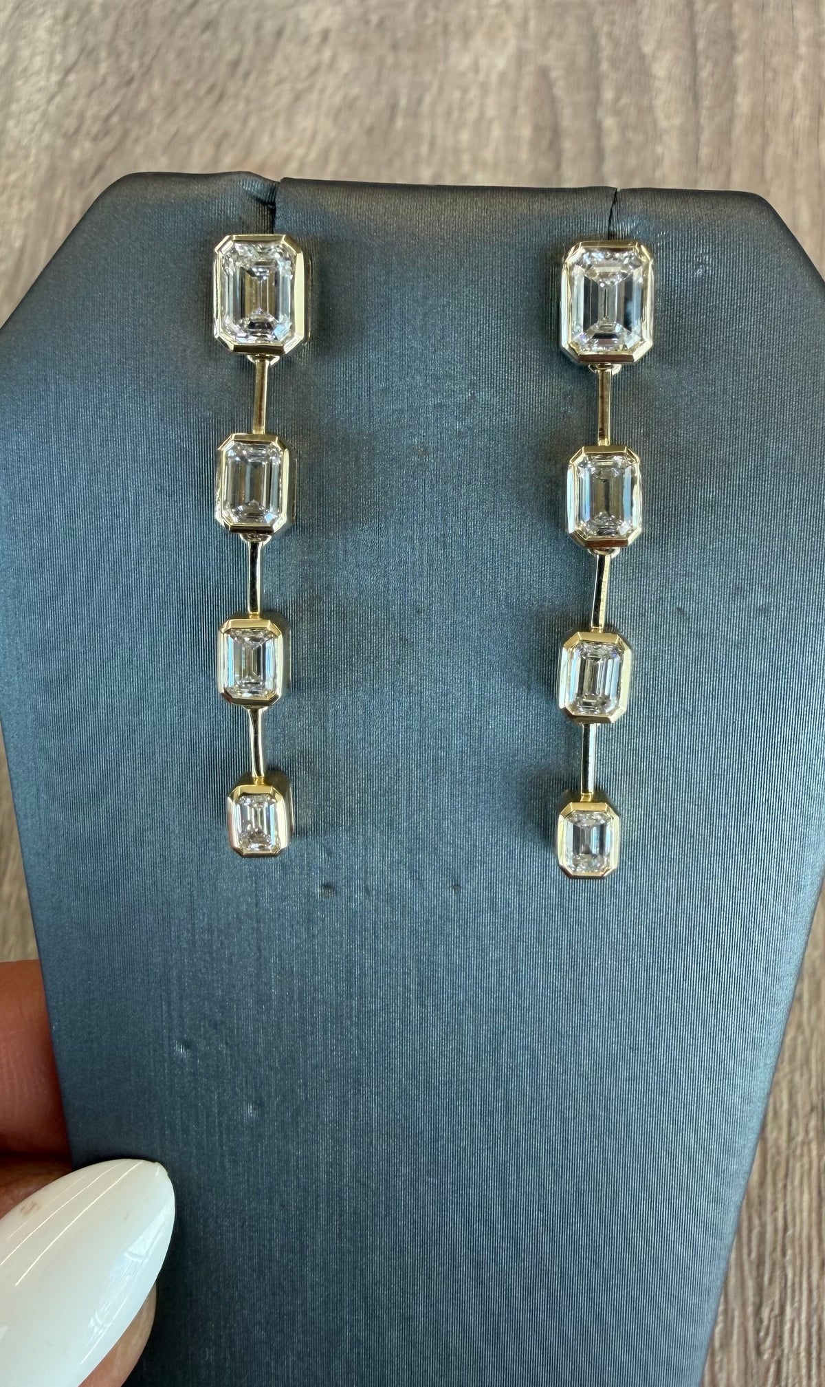 3.35 cttw graduated emerald bezel hanging earrings