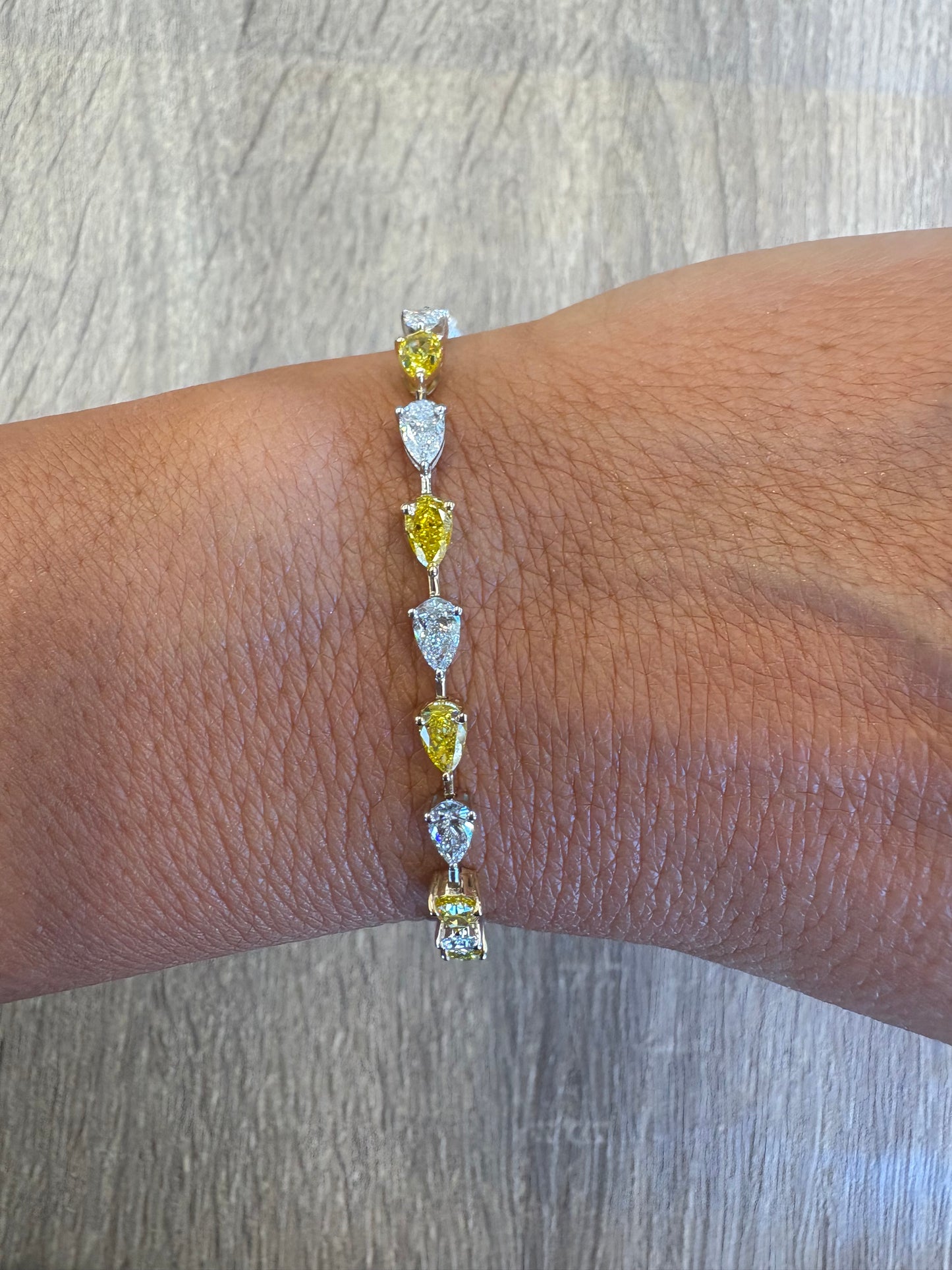 7.17 cttw east west pear alternating yellow & white tennis bracelet