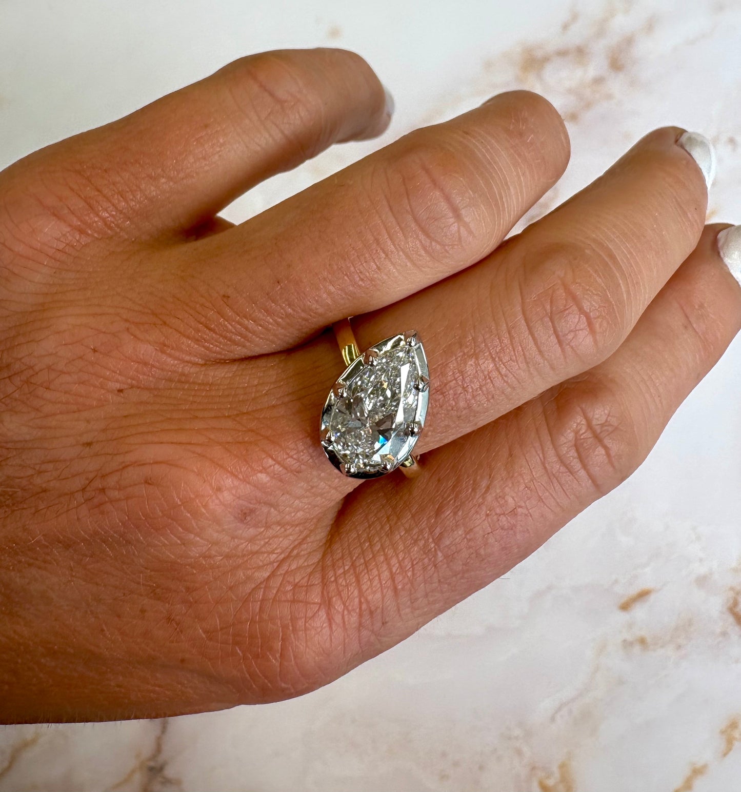3 ct slanted two tone pear bezel ring