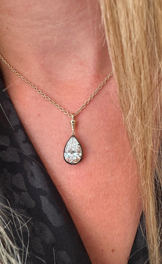 3 ct pear set in black rhodium on yellow gold chain