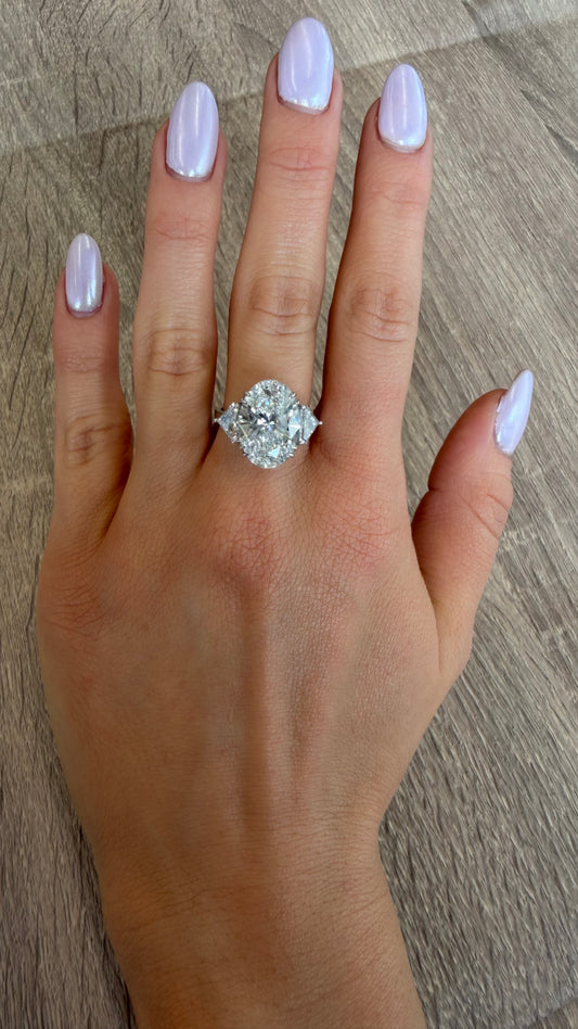 7 ct oval with trap side stones 8 cttw