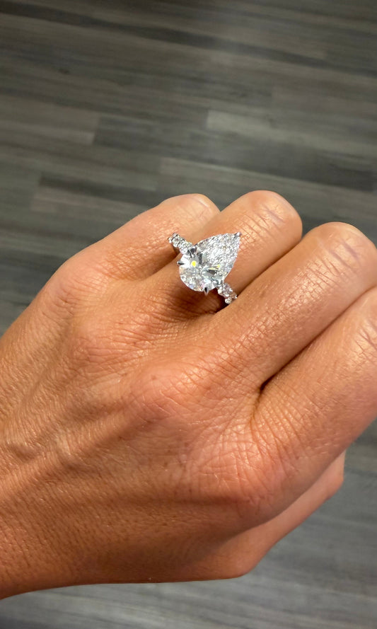 4.82 cttw pear engagement ring on diamond band