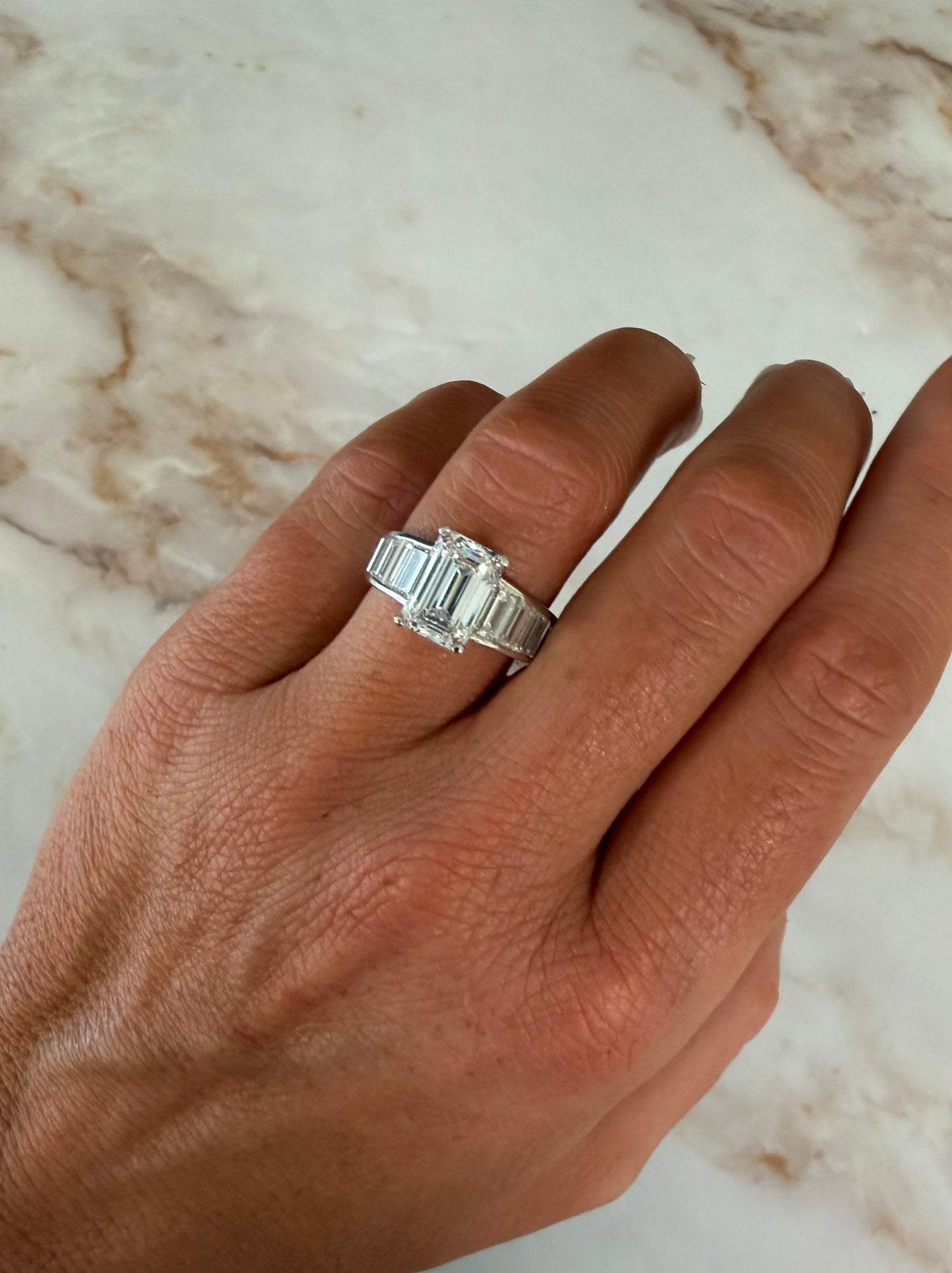 5.34 cttw emerald center with baguette sides