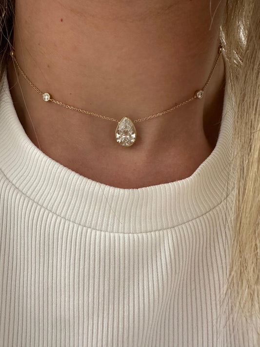 3.5 cttw diamond by the yard necklace with pear bezel center