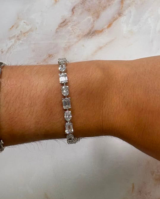 13.8 cttw east west oval + emerald tennis bracelet