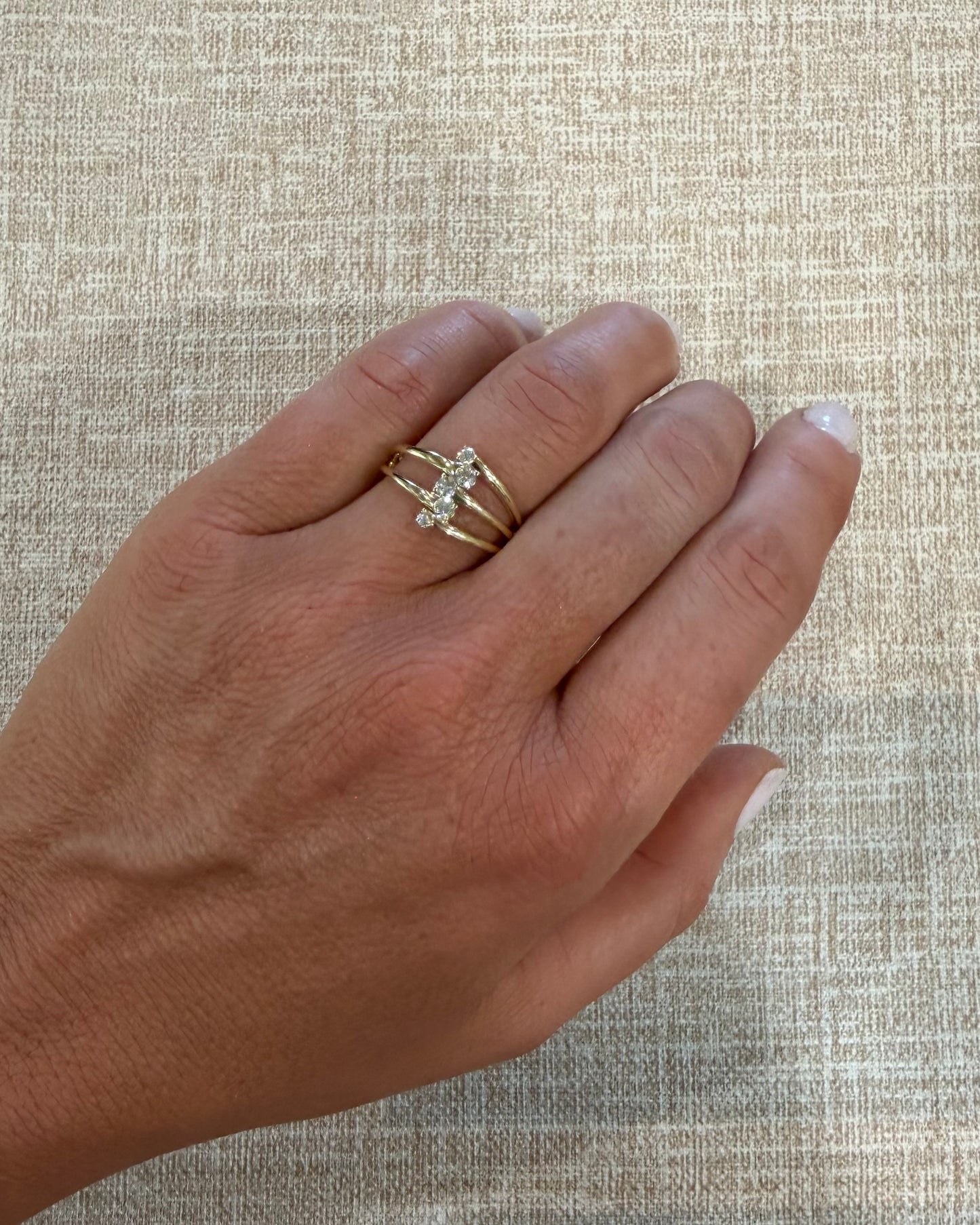 .25 cttw gold multi strand ring with small diamond center