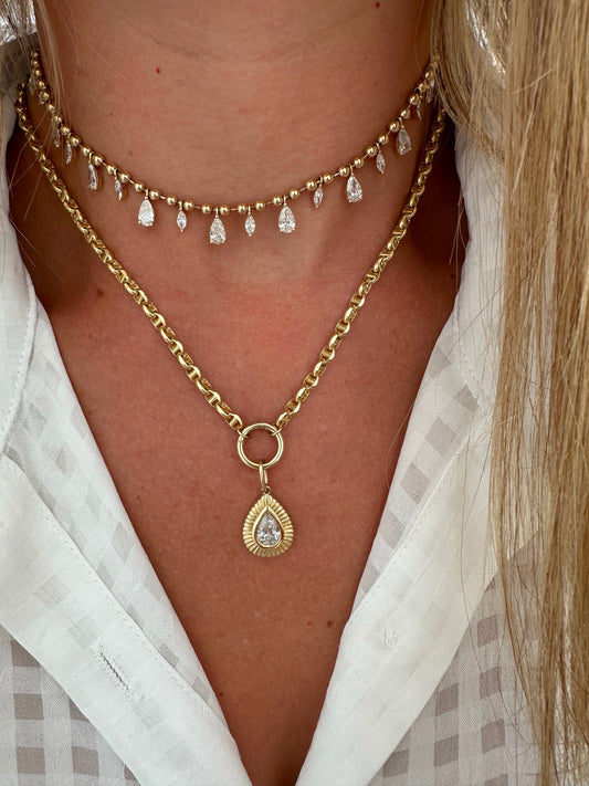 2 ct pear charm with fluted gold halo (no chain)