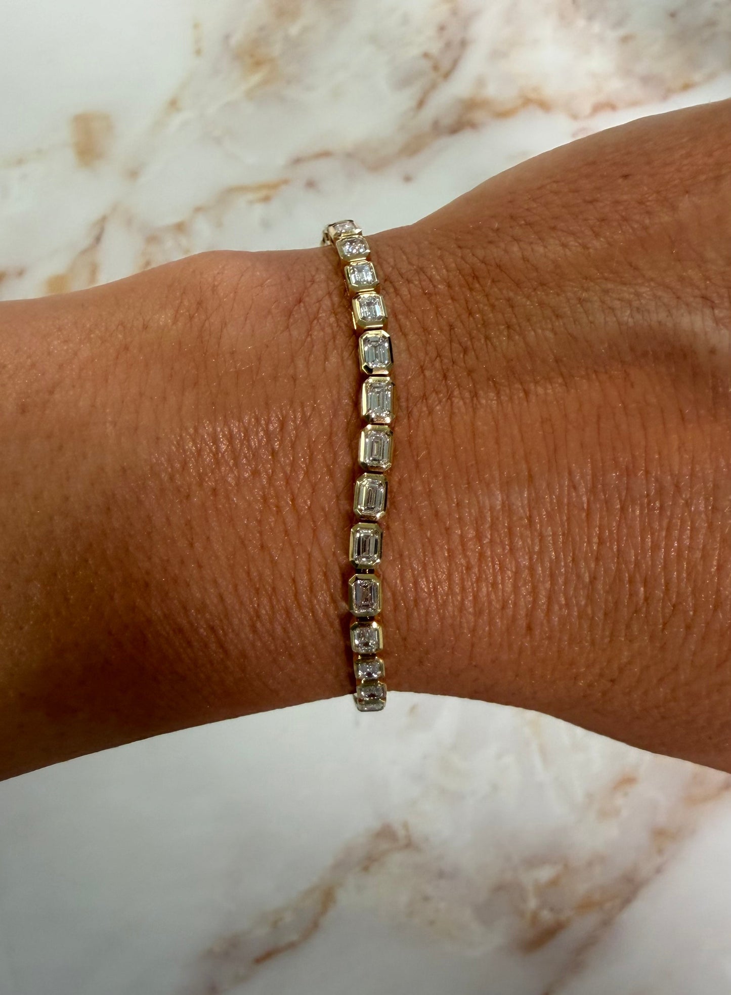 5.17 cttw east west bezel emerald tennis bracelet
