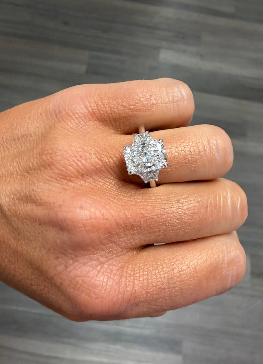 4.66 cttw radiant with trapezoid side stones engagement ring