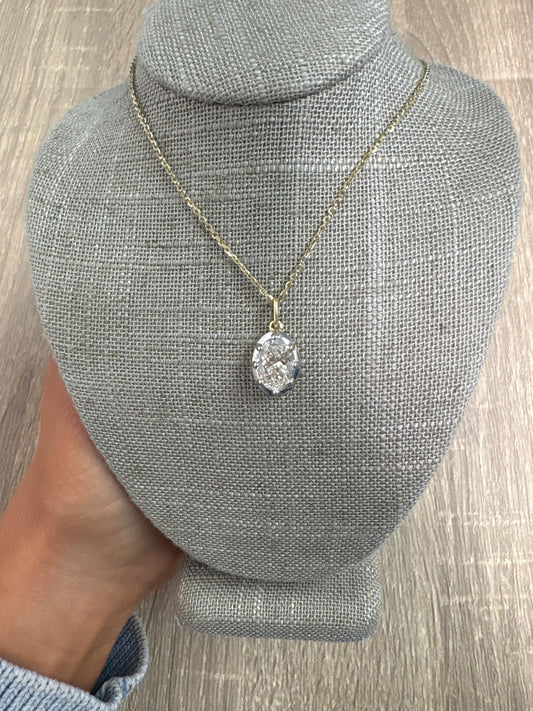 2 ct oval set in black rhodium bezel on yellow gold chain