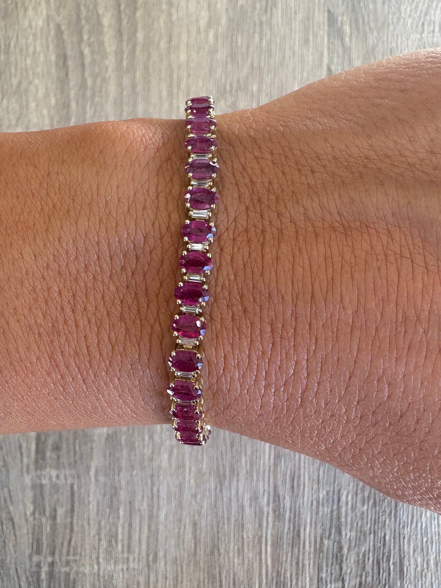 14.9 cttw ruby oval & baguette tennis bracelet set in yellow gold